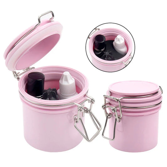 Pink container with lash glue inside